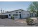 The exterior showcases a modern design with gravel landscaping and a unique roofline at 2345 N 28Th Pl, Phoenix, AZ 85008