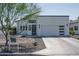 Modern home featuring clean lines, a well-manicured yard, and a two-car garage at 2345 N 28Th Pl, Phoenix, AZ 85008