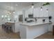 Spacious kitchen with dual islands, stainless appliances, and modern white cabinetry at 2345 N 28Th Pl, Phoenix, AZ 85008