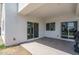 Covered patio with light walls, concrete floors and sliding glass doors leading to the interior of the house at 2345 N 28Th Pl, Phoenix, AZ 85008