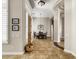 Open dining room featuring tile flooring, arched doorways, and abundant natural light at 26409 N 49Th Ln, Phoenix, AZ 85083