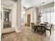 Open-concept dining area featuring tile floors, natural light, and seamless flow to other rooms at 26409 N 49Th Ln, Phoenix, AZ 85083