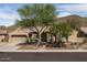 Charming single-story home featuring desert landscaping, a two-car garage, and a tile roof at 26409 N 49Th Ln, Phoenix, AZ 85083