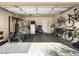 A garage is equipped for fitness, with exercise equipment and plenty of space for storage and organization at 26409 N 49Th Ln, Phoenix, AZ 85083