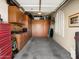 A garage offers plenty of storage space with cabinets and a workbench along one wall at 26409 N 49Th Ln, Phoenix, AZ 85083