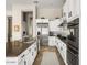 Bright kitchen with granite countertops, stainless steel appliances, and white cabinets at 26409 N 49Th Ln, Phoenix, AZ 85083