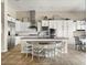 Bright kitchen featuring white cabinets, stainless steel appliances, and a large center island at 26409 N 49Th Ln, Phoenix, AZ 85083