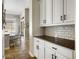 Additional kitchen view featuring granite countertops and white subway tile backsplash at 26409 N 49Th Ln, Phoenix, AZ 85083