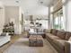 Open concept living room and kitchen, tile floors, natural lighting at 26409 N 49Th Ln, Phoenix, AZ 85083