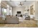 Spacious living room with fireplace, large windows, and neutral color palette at 26409 N 49Th Ln, Phoenix, AZ 85083