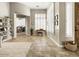 Inviting living area with tile flooring, neutral walls, and views into other spaces at 26409 N 49Th Ln, Phoenix, AZ 85083
