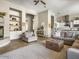 Open concept living room and kitchen, with neutral colors and fireplace at 26409 N 49Th Ln, Phoenix, AZ 85083