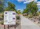 A park sign welcomes visitors to Deem Hills Park, offering information and directions at 26409 N 49Th Ln, Phoenix, AZ 85083