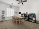 Versatile playroom with carpet, ample storage, and natural light from the window at 26409 N 49Th Ln, Phoenix, AZ 85083