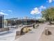 The community offers a tennis court, seating, and walking paths for the enjoyment of residents at 26409 N 49Th Ln, Phoenix, AZ 85083