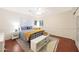 Cozy bedroom with neutral walls, wood floors, a ceiling fan, and plenty of natural light at 27803 N 59Th Dr, Phoenix, AZ 85083