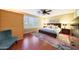 Cozy bedroom with hardwood floors, natural light, and ceiling fan at 27803 N 59Th Dr, Phoenix, AZ 85083