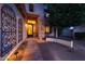 Charming front entrance featuring decorative ironwork, stone accents, and a welcoming covered porch at 27803 N 59Th Dr, Phoenix, AZ 85083