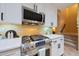 Gourmet kitchen with stainless steel range, white cabinets, and modern appliances for a chef-inspired experience at 27803 N 59Th Dr, Phoenix, AZ 85083