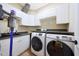 Laundry room features a front-load washer and dryer, and lots of storage space at 27803 N 59Th Dr, Phoenix, AZ 85083