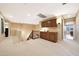 Open loft area features built-in cabinets, a staircase, and leads to multiple rooms at 27803 N 59Th Dr, Phoenix, AZ 85083