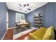 Stylish office offers natural light, wood floors, and dark blue paint at 27803 N 59Th Dr, Phoenix, AZ 85083