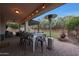 Outdoor patio with dining set, heater, pergola, and lounge area, perfect for relaxing at 27803 N 59Th Dr, Phoenix, AZ 85083