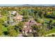 Sprawling estate featuring a private pool, lush landscaping, and scenic lake views in an aerial shot at 29 E Oakwood Hills Dr, Chandler, AZ 85248