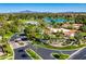 Aerial photo of upscale neighborhood with lake views, community entrance and beautiful landscaping at 29 E Oakwood Hills Dr, Chandler, AZ 85248