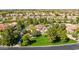 Aerial view featuring a beautifully landscaped yard, circular driveway, and elegant home design at 29 E Oakwood Hills Dr, Chandler, AZ 85248