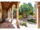 Beautiful courtyard with arched colonnade, tile flooring, and a serene fountain at 29 E Oakwood Hills Dr, Chandler, AZ 85248