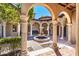 Inviting courtyard featuring a tiered fountain and arched entrance to the main house at 29 E Oakwood Hills Dr, Chandler, AZ 85248