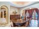 Well-lit dining room with detailed woodwork, french doors and curated decor at 29 E Oakwood Hills Dr, Chandler, AZ 85248