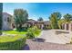 Stately home featuring a long driveway, beautiful landscaping, and a well-manicured front yard at 29 E Oakwood Hills Dr, Chandler, AZ 85248
