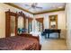 Opulent main bedroom showcases antique armoire, framed artwork, high ceilings and grand piano at 29 E Oakwood Hills Dr, Chandler, AZ 85248