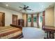 Spacious main bedroom featuring large windows, neutral decor, and views of the surrounding landscape at 29 E Oakwood Hills Dr, Chandler, AZ 85248