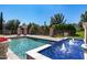 Backyard pool with fountains and stone columns showcasing a resort-style outdoor living at 29 E Oakwood Hills Dr, Chandler, AZ 85248