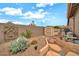 Gravel backyard with storage shed, cactus, and decorative wall art at 2959 W Eastman Dr, Anthem, AZ 85086
