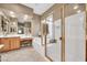 Bright bathroom featuring a soaking tub, shower with glass door, tile floor, and vanity at 2959 W Eastman Dr, Anthem, AZ 85086