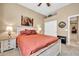 A cozy bedroom with a ceiling fan, soft carpet, and a built-in closet at 2959 W Eastman Dr, Anthem, AZ 85086