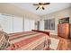 This cozy bedroom has a ceiling fan, wood floors, soft carpet, with closet doors at 2959 W Eastman Dr, Anthem, AZ 85086