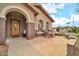 Welcoming front porch featuring a charming seating area and a view of the street at 2959 W Eastman Dr, Anthem, AZ 85086