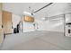 A clean, well-organized garage with epoxy floor, built-in cabinets, and ample space for parking and storage at 2959 W Eastman Dr, Anthem, AZ 85086