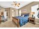Serene main bedroom with a ceiling fan, side tables, and comfortable sleeping arrangements at 2959 W Eastman Dr, Anthem, AZ 85086