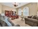 Comfortable home office with built-in bookshelves and plenty of natural light at 2959 W Eastman Dr, Anthem, AZ 85086