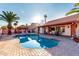 Resort-style backyard with a sparkling pool, covered patio, lush landscaping, and a cozy gazebo at 3037 E Mallory St, Mesa, AZ 85213