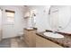 Bathroom featuring a double vanity, tile countertop, and decorative mirrors at 3037 E Mallory St, Mesa, AZ 85213