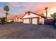 Beautiful exterior view of a well-maintained home with a spacious driveway and desert landscaping at 3037 E Mallory St, Mesa, AZ 85213