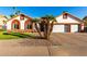 Charming home featuring manicured landscaping and a two-car garage, perfect for curb appeal at 3037 E Mallory St, Mesa, AZ 85213