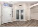 Inviting foyer featuring a decorative glass window, durable flooring, and a welcoming entrance at 3037 E Mallory St, Mesa, AZ 85213